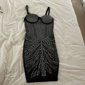Dress perfect for going out. Black short dress with pearls and beads.